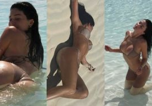 Kylie Jenner w skąpym bikini pręży podrasowane chirurgicznie wdzięki na plaży, tarzając się po piasku (ZDJĘCIA)