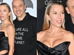 Wydekoltowana Ewa Chodakowska kokietowała frywolną kreacją. Jej mąż wolał bluzę